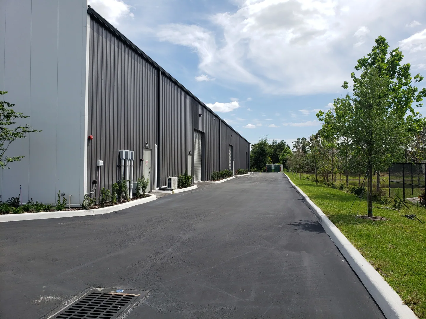 Paved access alongside the commercial building