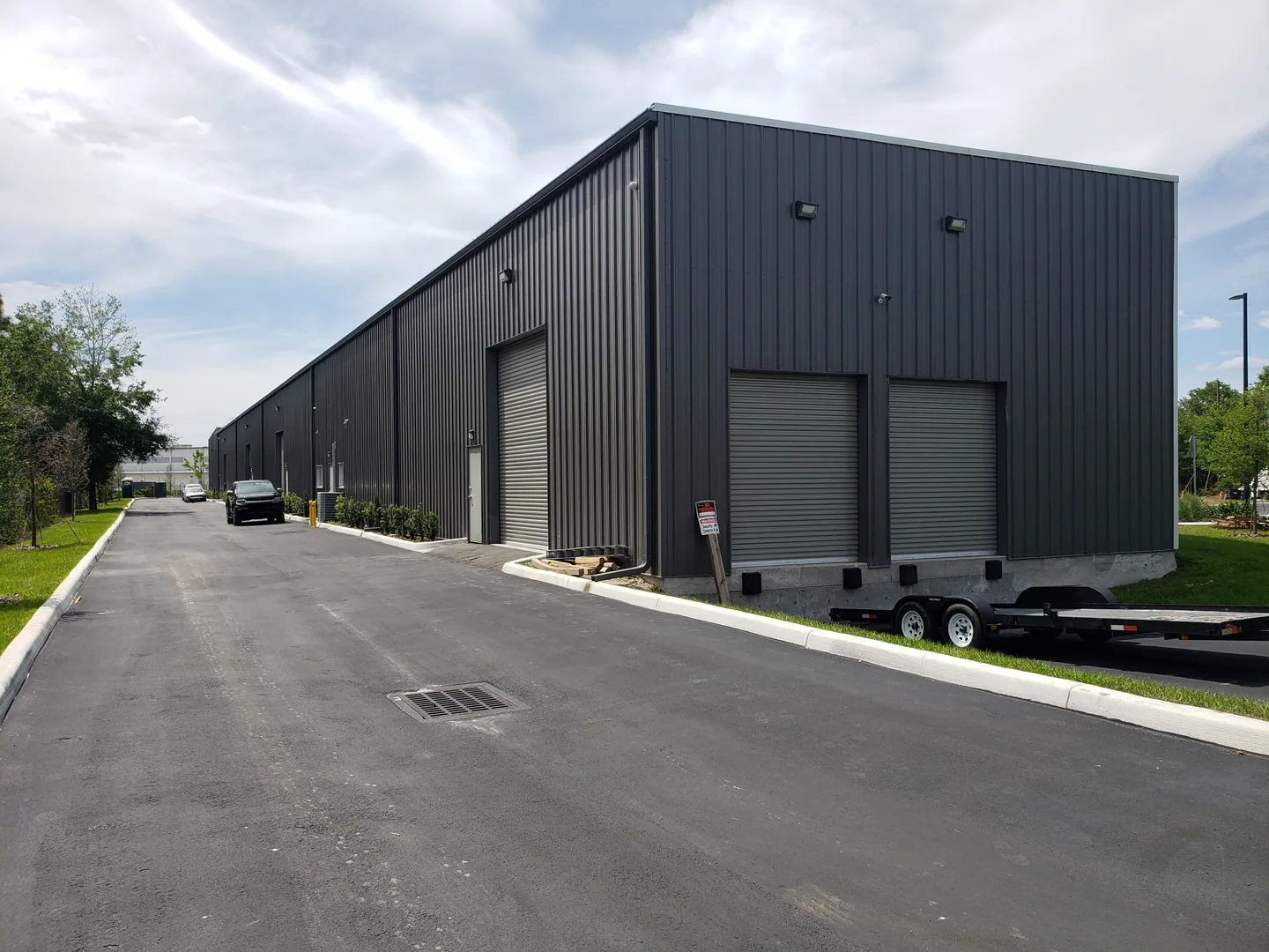 Commercial warehouse exterior with overhead doors